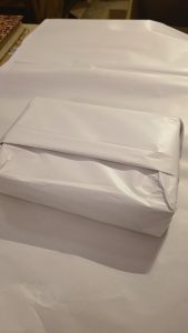 Livres de collection emballés avec papier expert avant transport sécurisé vers expertise ou commissaire-priseur.